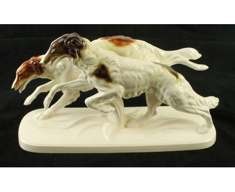 An Art Deco Katzhutte ceramic figure groupModelled in the form of two running borzoi dogs, factory marks to base, height 19cm
