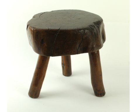 A small 19th Century elm milking stool   CONDITION REPORT:  One leg looseGeneral surface marks and minor splits 