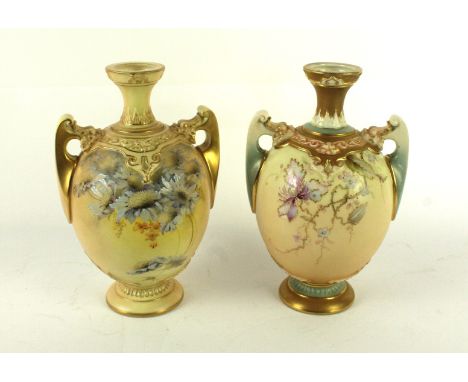 A matched pair of Royal Worcester twin handled vasesEach of bulbous form raised on pedestal bases, decorated with hand painte