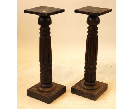 A pair of 19th Century mahogany torchere plant standsFluted and foliate carved columns on square plinth bases, height 85cm, t