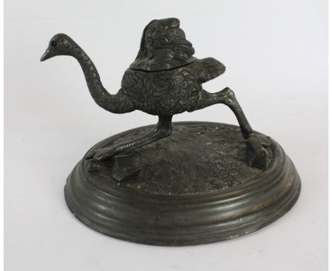 An unusual 19th Century pewter inkwell Formed as a ostrich raised on an oval plinth base, 19cm wide  