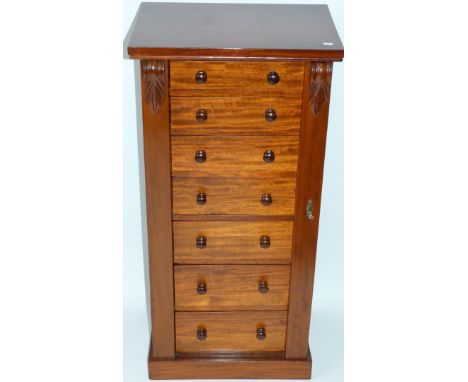 A Victorian mahogany Wellington chest of typical formThe body with seven drawers, raised on a plinth base, height 101cm, widt