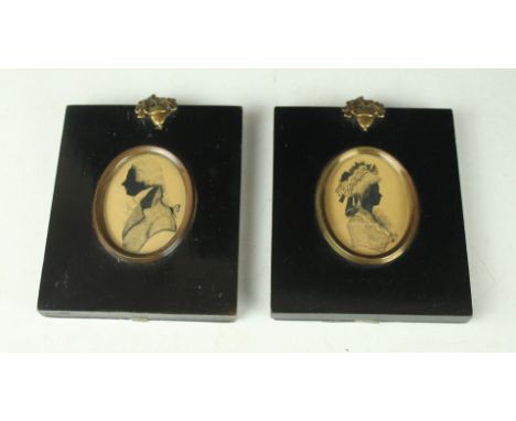 A pair of 19th Century watercolour portrait miniaturesDepicting a Georgian gentleman and lady, each inset within lacquered fr