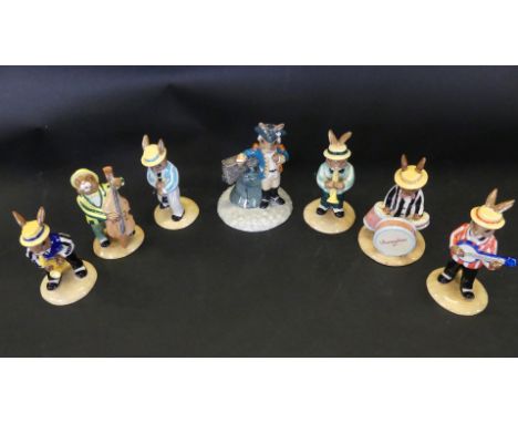 A seven piece Royal Doulton Bunnykins bandComprising Clarinet Bunnykin, Saxophone Bunnykin, Banjo Bunnykin, Double Base Bunny