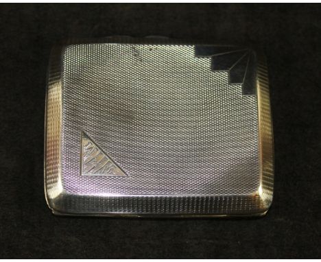 An Art Deco silver cigarette caseOf rectangular form with engine turned decoration, by Harman Brothers, Birmingham 1932, leng