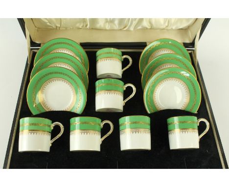 A Royal Worcester six setting coffee serviceDecorated with gilt sprays on a green and white glazed body, puce factory marks a