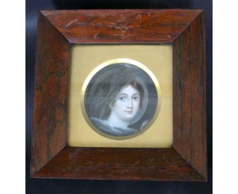 A 19th Century portrait miniature on ivoryDepicting a classical maiden wearing a hat, 8.5cm diameter