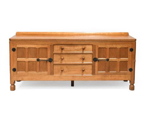 Workshop of Robert Mouseman Thompson (Kilburn): An English Oak 6ft Sideboard, 1970s, with raised upstand, adzed top over two 