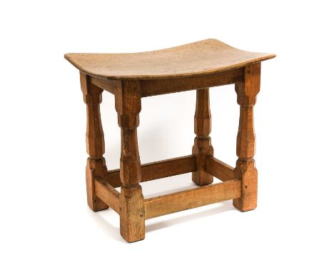 Workshop of Robert Mouseman Thompson (Kilburn): An English Oak Dish Top Stool, the rectangular nailed and adzed top, on four 