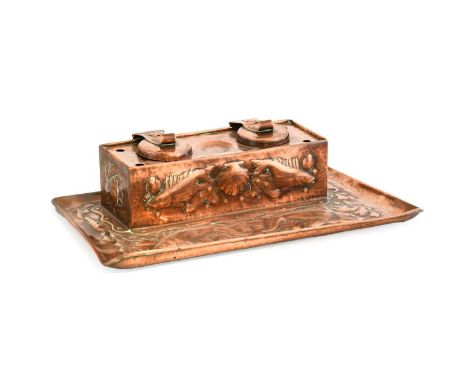 An Arts & Crafts Newlyn Copper Double Inkwell, repoussé decorated with fish and shells, stamped NEWLYN, 31.5cm wide, 20cm dee