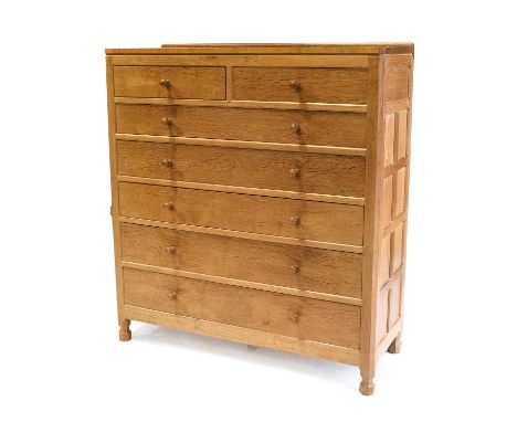 Workshop of Robert Mouseman Thompson (Kilburn): A Bespoke English Oak Panelled Chest of Drawers, with raised upstand, above t