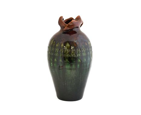 Christopher Dresser (Scottish, 1834-1904) for Linthorpe Pottery: A Vase, shape No.167, moulded with repeating patterns under 