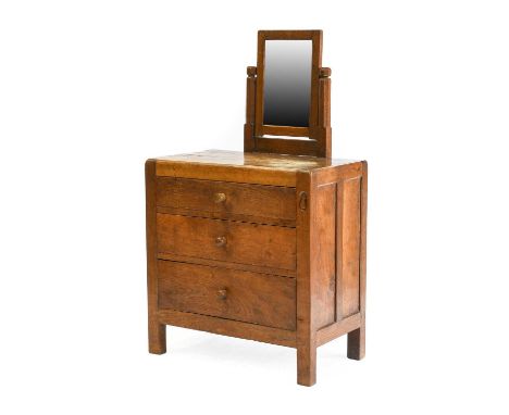 Robert Mouseman Thompson (1876-1955): An English Oak Panelled Dressing Chest, circa 1930s, with a rectangular mirror, above t