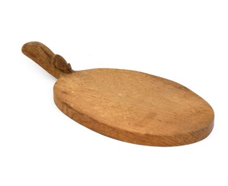 Workshop of Robert Mouseman Thompson (Kilburn): An English Oak Cheese Board, post 1960, of standard form, with carved mouse t