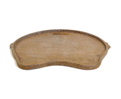 Workshop of Robert Mouseman Thompson (Kilburn): An English Oak Kidney Tea Tray, with carved mouse trademark handles,47cm wide