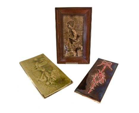 A Minton's China Works Tile, moulded with a classical maiden and three cupids, olive glaze, impressed factory marks,41cm by 2