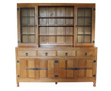 Workshop of Robert Mouseman Thompson (Kilburn): An English Oak Display Dresser, penny moulded top above a central open sectio