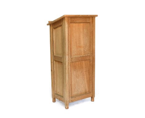 Workshop of Robert Mouseman Thompson (Kilburn): An English Oak Panelled Lectern, slope top, single shelf, on four octagonal f