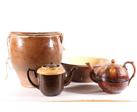 Glazed stoneware storage crock, 30cm high, two treacle glazed teapots, and a vintage mixing bowl.&nbsp; (4) 