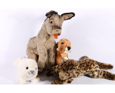 Collection of Steiff animals to include 'Grissy the Donkey', leopard, fawn and seal pup. (4) 