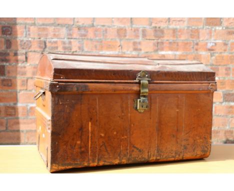 Dome-topped tin trunk. 