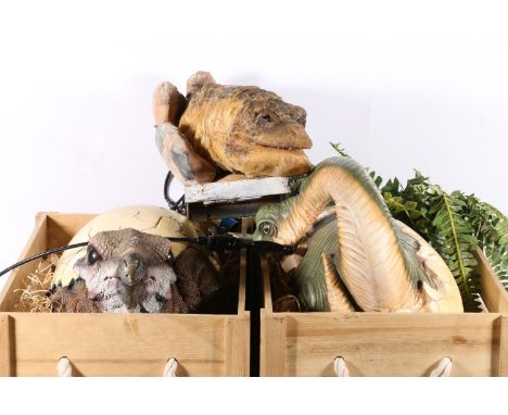 Three dinosaur movie props. 