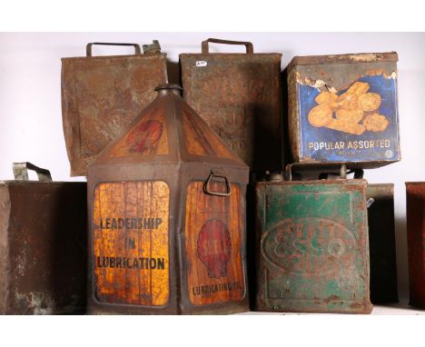 Nine vintage petroleum and oil cans to include Shell, Pratt and BP, etc. 