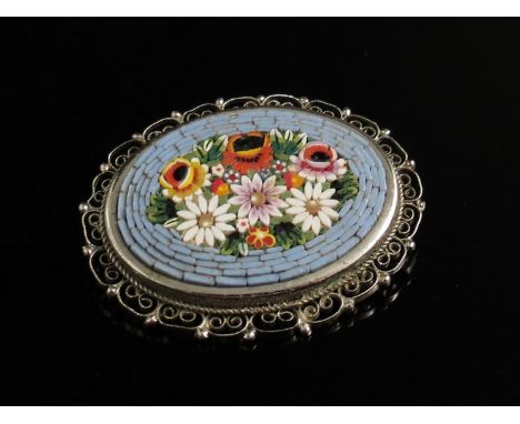 A micro mosaic brooch, white metal filigree surround 