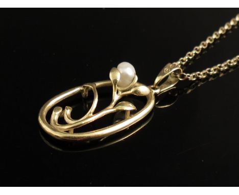 A 9ct gold chain hung with foliate pearl set pendant 