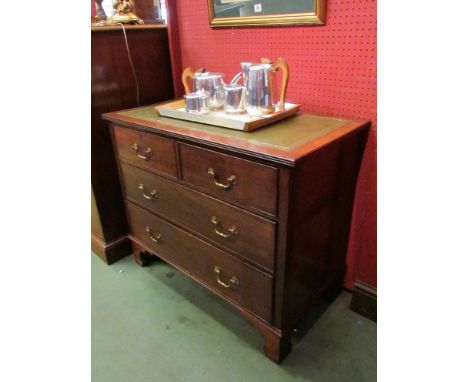 An Edwardian mahogany chest of two short over two long drawers with gilt tooled leather insert on bracket feet, 74cm x 90cm x