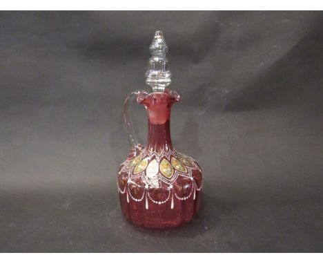A very ornate Cranberry glass decanter with stopper, enamelled decoration