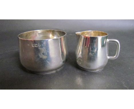 An Edwardian silver miniature sucrier and creamer of plain form, London 1901 dented, 74 grams