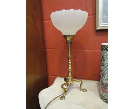 A brass turned column table lamp on three cabriole feet with opaque glass shade, 43cm tall 