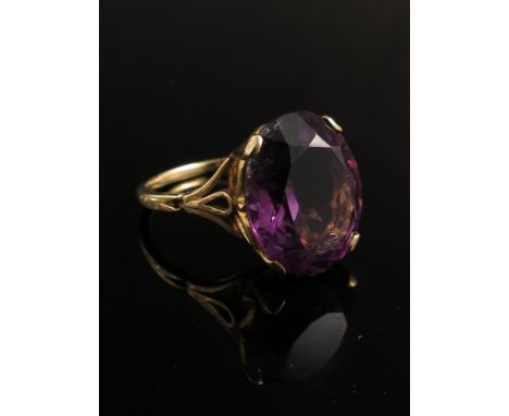 A 9ct gold ring set with large oval amethyst