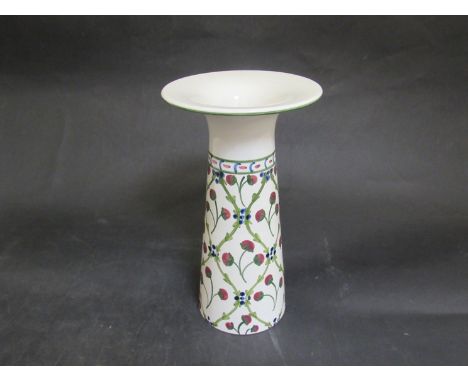A ceramic vase with vine and fruit design, signed Liberty to base No. 2460