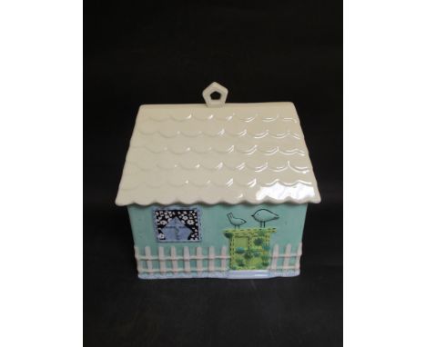 A ceramic cannister as a cottage, 30cm long