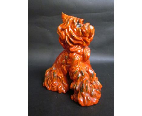 Ida Meisinger for Goldscheider - an orange glazed figure of a long haired terrier, No. 5705. Printed and incised marks to bas