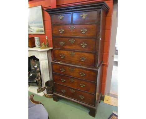 A George III mahogany chest on chest with pierced Chippendale handles, blind fret canted corners, bracket feet, 195cm x 102cm