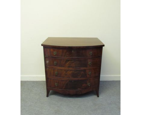 A George III revival flamed mahogany chest of small proportions with ebony line crossbanding, the four graduating long drawer