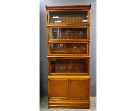 Globe Wernicke type Barrister's teak bookcase with five glazed sections above a cupboard base, paper labels to the back and D