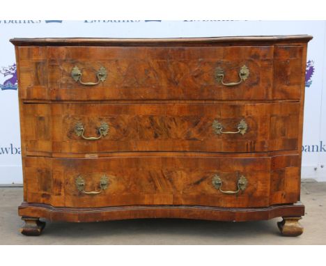 19th century German walnut serpentine commode, the top with marquetry and cross banding over three long drawers, on shaped fe