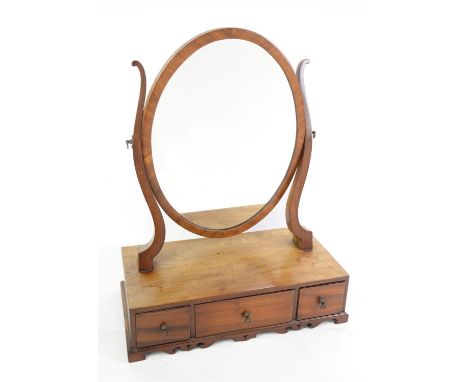 George III style mahogany toilet mirror, the oval swing plate on a base with three drawers and bracket feet, 57 cm high