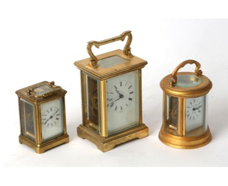 Brass cased carriage clock by P.S.B Harrow, circular carriage clock by Elliot & Sons, and a miniature carriage clock (3)