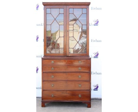 Regency mahogany secretaire bookcase, the rope twist cornice over a pair of astragal glazed doors, the base with dummy front 