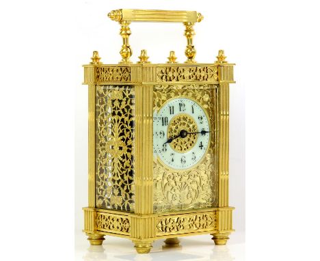 Gilt metal and four glass carriage clock with barrel movement, the enamelled chapter ring with Arabic numerals, extensively d