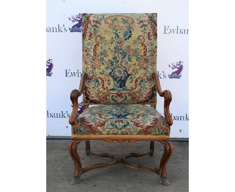 † Charles I style walnut and tapestry open armchair, with moulded arms and moulded cabriole legs joined by a cross stretcher 