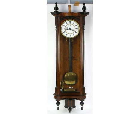 Vienna type walnut and ebonised regulator wall clock, with triangular pediment and turned finials over an enamel dial with su