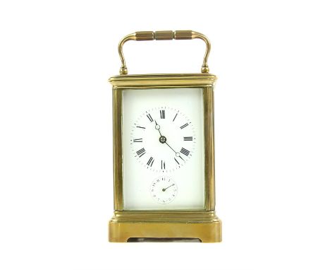 Early 20th century French lacquered brass carriage clock the white enamel face with subsidiary alarm dial, striking the hours