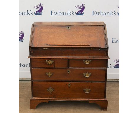 George II style oak bureau with fall flap enclosing cupboard, flanked by narrow compartments with pigeon holes, drawers and a