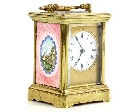 Brass and glass carriage clock with French lever movement, the white enamelled dial with Roman numerals, the sides printed an